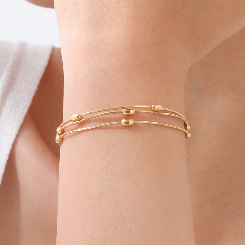Gold-Plated Multi-Layer Snake Chain Bracelet with Oval Beads