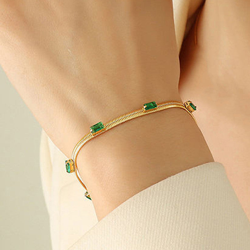 Gold-Plated Snake Chain Bracelet with Green Crystal Accents