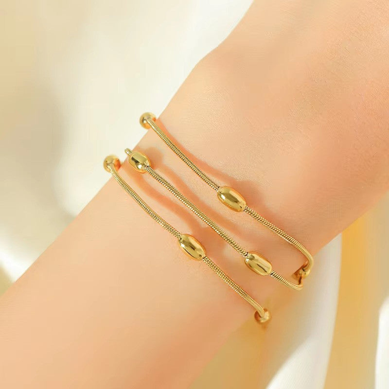 Gold-Plated Multi-Layer Snake Chain Bracelet with Oval Beads