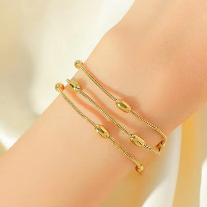 Gold-Plated Multi-Layer Snake Chain Bracelet with Oval Beads