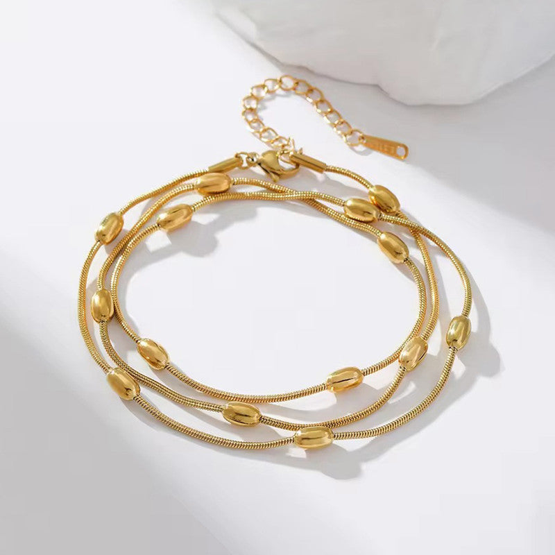 Gold-Plated Multi-Layer Snake Chain Bracelet with Oval Beads