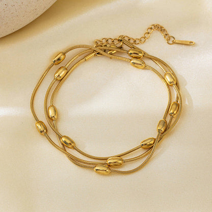 Gold-Plated Multi-Layer Snake Chain Bracelet with Oval Beads