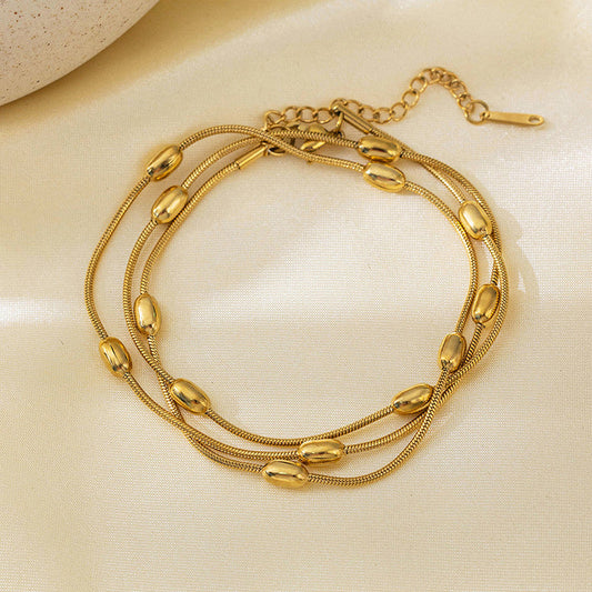 Gold-Plated Multi-Layer Snake Chain Bracelet with Oval Beads