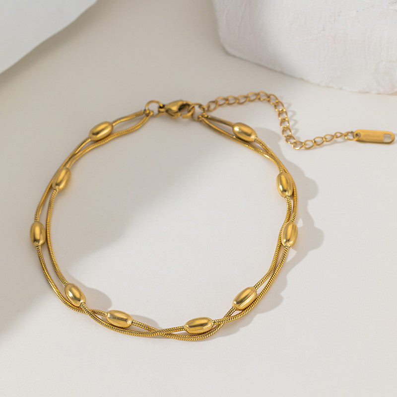 Gold-Plated Multi-Layer Snake Chain Bracelet with Oval Beads