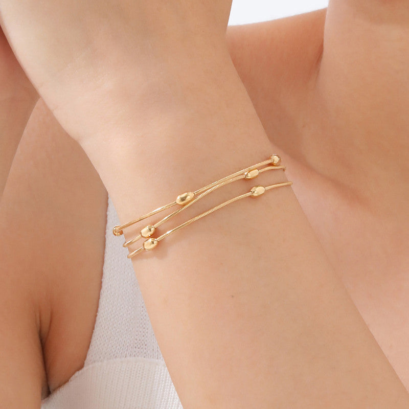 Gold-Plated Multi-Layer Snake Chain Bracelet with Oval Beads