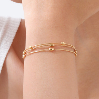 Gold-Plated Multi-Layer Snake Chain Bracelet with Oval Beads